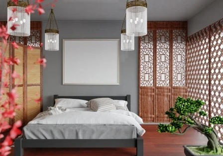 A serene bedroom with a low bed, soft linens and natural light
