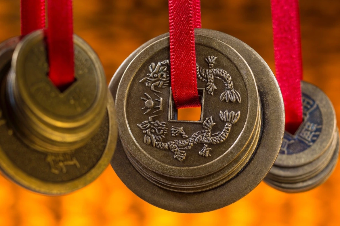 Chinese feng shui coins on red ribbon